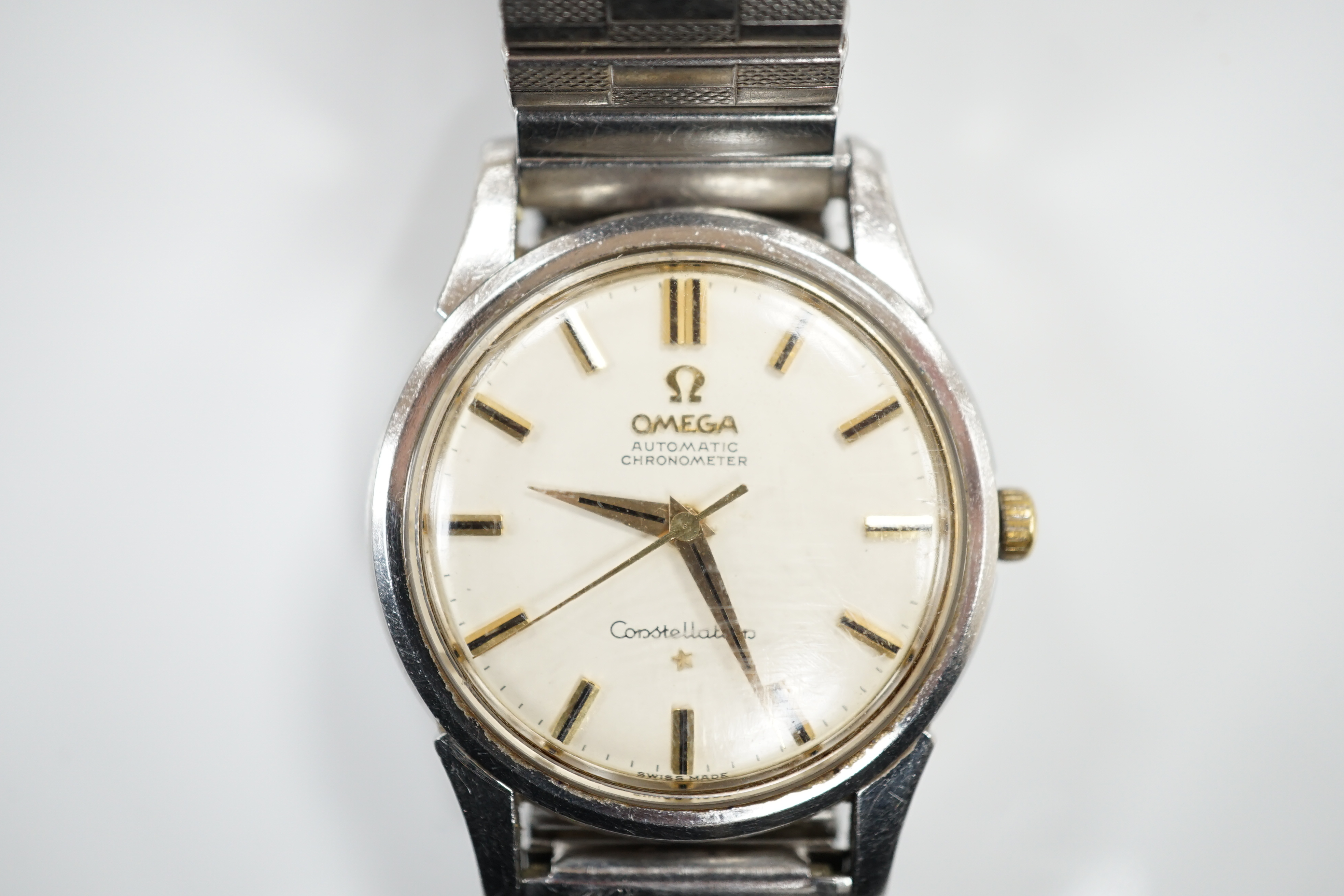 A gentleman's early 1960's stainless steel Omega Constellation Automatic Chronometer wrist watch, on an associated flexible bracelet, case diameter 35mm, movement c.551